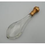 An 18 ct gold topped scent bottle. 13 cm high.