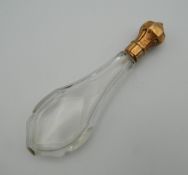 An 18 ct gold topped scent bottle. 13 cm high.