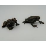 Two bronze models of frogs. The largest 4.5 cm long.