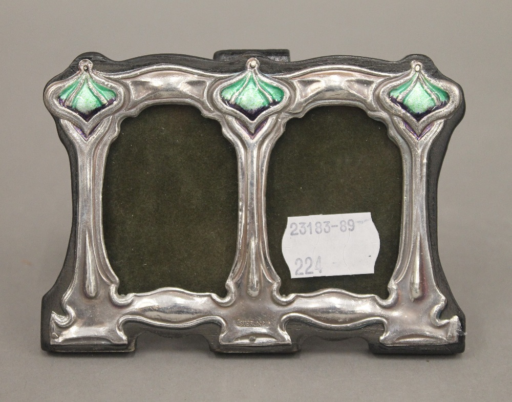 A double silver Art Nouveau style photograph frame. 11 cm wide.