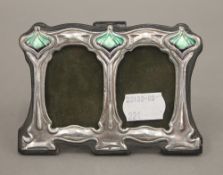 A double silver Art Nouveau style photograph frame. 11 cm wide.