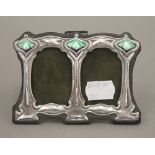 A double silver Art Nouveau style photograph frame. 11 cm wide.