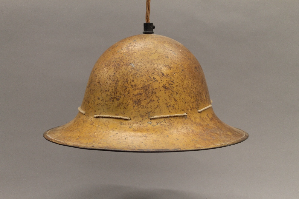 A Belgian military helmet, converted to a hanging lamp. 29 cm wide. - Image 2 of 3