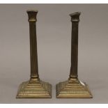 A pair of Georgian brass candlesticks. 25 cm high.