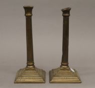 A pair of Georgian brass candlesticks. 25 cm high.