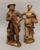 A large pair of figures. The largest 62 cm high.