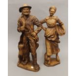 A large pair of figures. The largest 62 cm high.