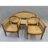 An early 20th century caned three piece suite. The settee 126 cm wide.