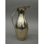 A sterling silver Georg Jensen style ewer. 25 cm high. 12.8 troy ounces.