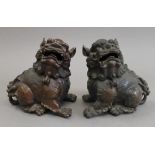 A pair of Chinese bronze dogs-of-fo. 15.5 cm high.