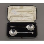 A pair of boxed silver serving spoons, hallmarked London 1909. 99.3 grammes.