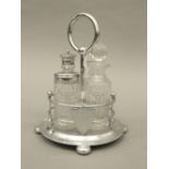 An early 20th century cut glass and silver plated cruet stand. 21 cm high.