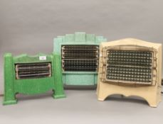 Three vintage enamel decorated heaters and a modern fan. The largest 38 cm high.