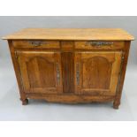 A 19th century French cherrywood buffet. 143 cm wide, 96.5 cm high, 64 cm deep.