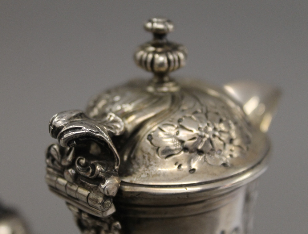 A silver embossed chocolate pot. 21 cm high. 19.6 troy ounces total weight. - Image 7 of 8