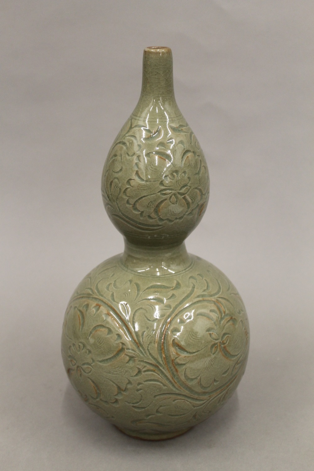A Chinese double gourd celadon vase. 33.5 cm high.