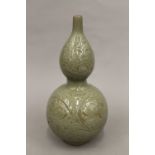A Chinese double gourd celadon vase. 33.5 cm high.