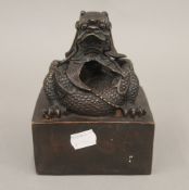 A bronze dragon seal. 15 cm high.