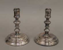 A pair of Christofle candlesticks. 16 cm high.