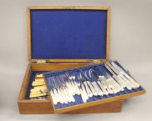 A canteen containing various plated cutlery. 47 cm wide.