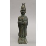 A Chinese bronze model of an attendant. 24.5 cm high.