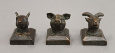 Three bronze animal seals. Each approximately 4 cm high.