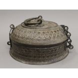 An Indian antique brass food box. 24 cm diameter.