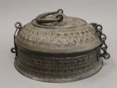 An Indian antique brass food box. 24 cm diameter.