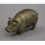 A brass model of a pig. 9 cm long.