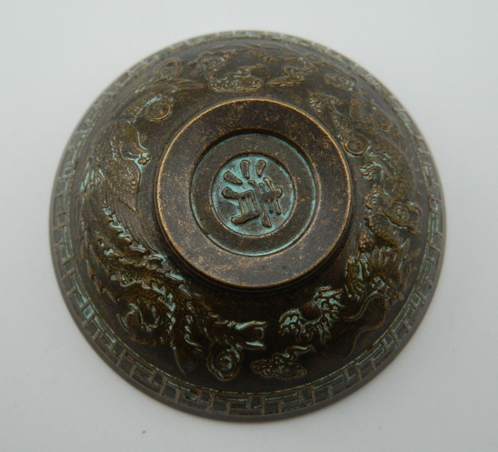 A small Chinese bronze bowl. 6 cm diameter. - Image 3 of 3