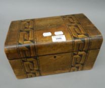 A Victorian inlaid walnut sewing box. 28 cm wide.