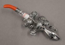 A 800 silver rattle. 13 cm long.