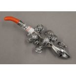 A 800 silver rattle. 13 cm long.