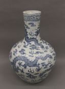 A Chinese porcelain blue and white vase. 59 cm high.