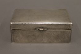 A Chinese silver cigarette box. 15.5 cm wide. 19.1 troy ounces total weight.