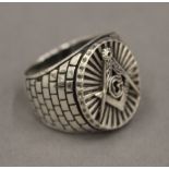A silver Masonic type ring.