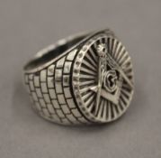 A silver Masonic type ring.