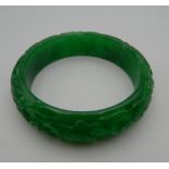 An apple green jade bangle. 7.5 cm diameter.