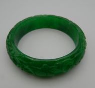 An apple green jade bangle. 7.5 cm diameter.