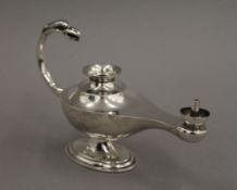 A novelty silver 'Aladdin's lamp' cigar lighter, Birmingham 1919. 14.5 cm long. 106.
