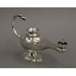 A novelty silver 'Aladdin's lamp' cigar lighter, Birmingham 1919. 14.5 cm long. 106.