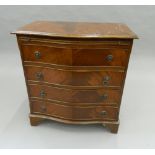 A small modern serpentine front chest of drawers with brushing slide. 72.5 cm wide.