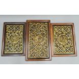 Three Chinese gilt heightened pierced and carved wooden panels. The largest 48.5 x 81 cm.