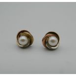 A pair of 9 ct tri-colour gold and pearl earrings. 8 cm diameter.