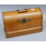 A Victorian cased Singer sewing machine