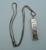 A silver ingot on chain. The ingot 4 cm high. 39.7 grammes total weight.