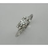 A 14 K white gold diamond ring, set with a 0.