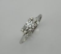 A 14 K white gold diamond ring, set with a 0.