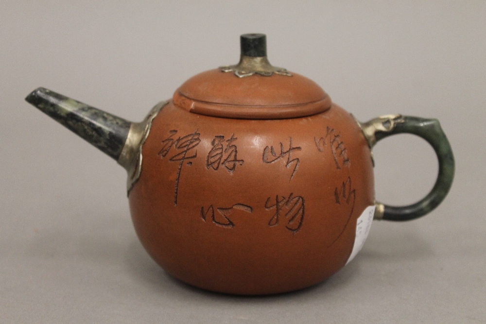 A Chinese Ying Xing and jade teapot. 18 cm long.