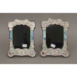 A pair of silver Art Nouveau style photograph frames. 21 cm high.